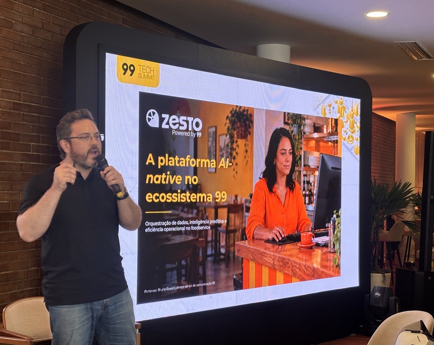 Logo da plataforma Zesto exibido em tela durante evento da 99